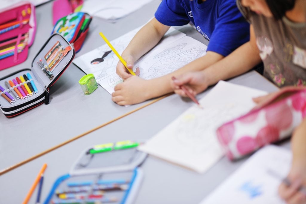 Children drawing at table - Free Activities At Your Local Library