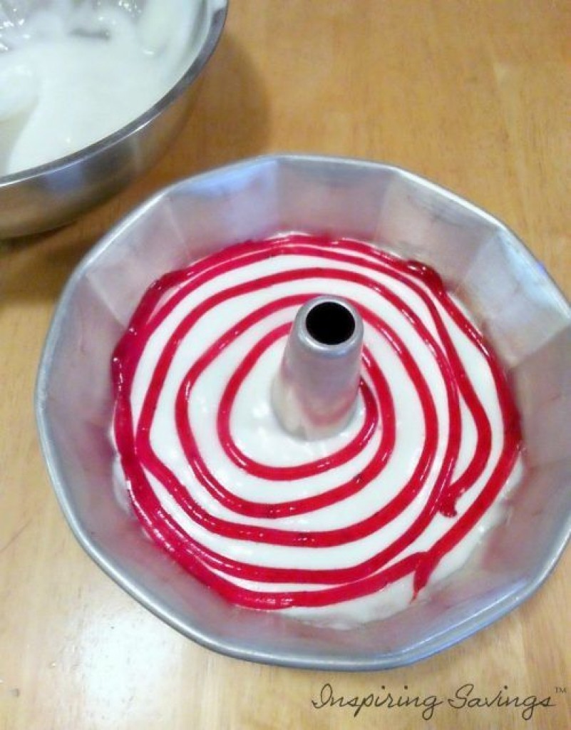 Angel Food Cake batter with strawberry filling being added