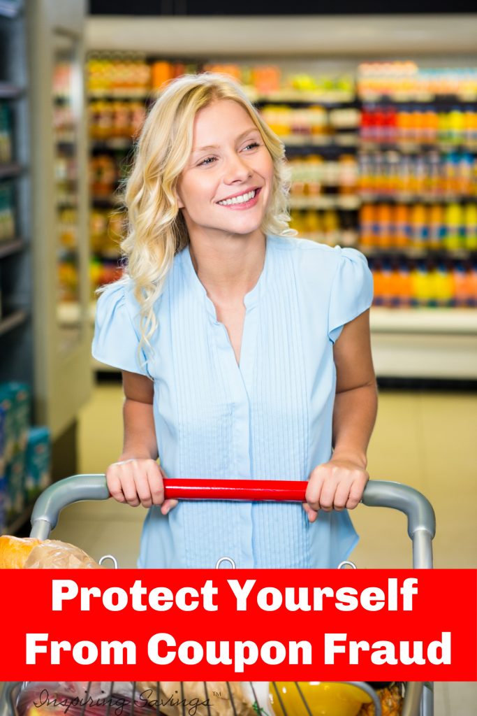 Smiling woman pushing trolley in aisle in supermarket