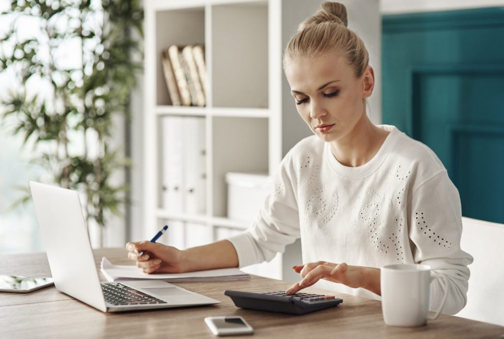 Woman working on budget - Top Budgeting Mistakes You Don’t Realize You’re Making