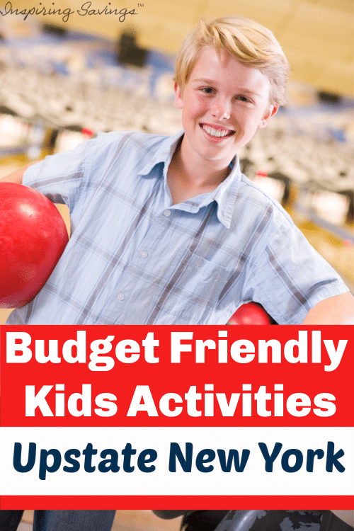 Boy holding red bowling ball. Budget friendly kids activities