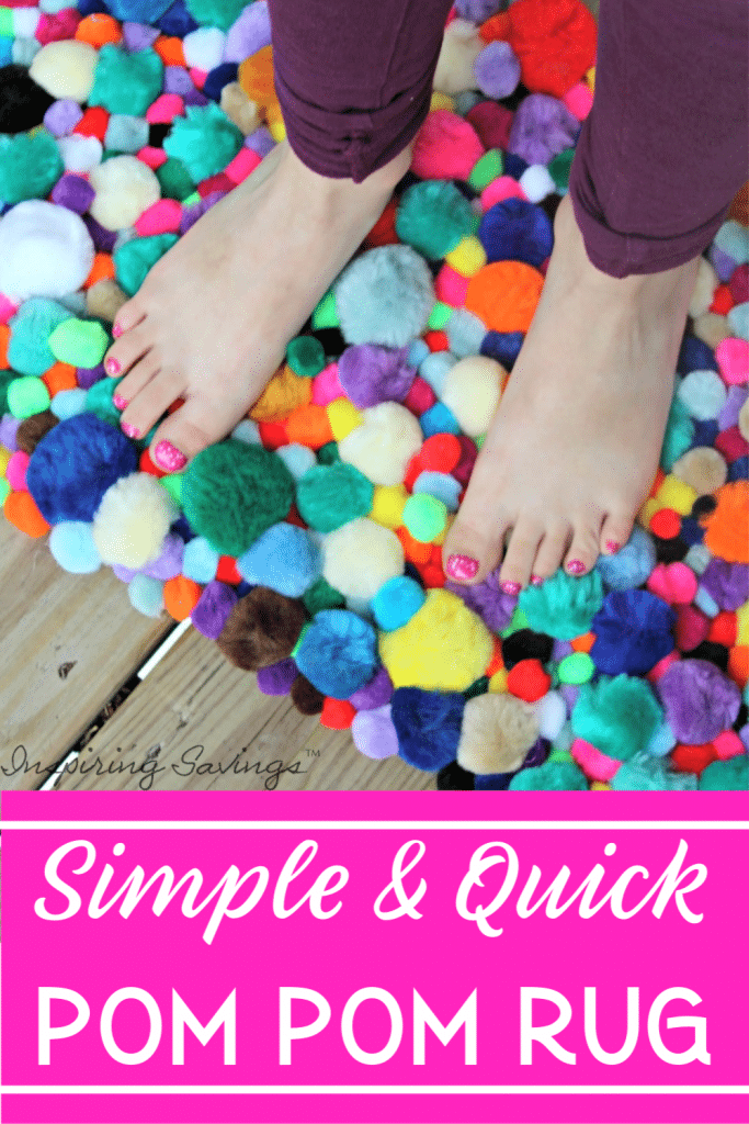 Young girl standing on homemade pom pom rug