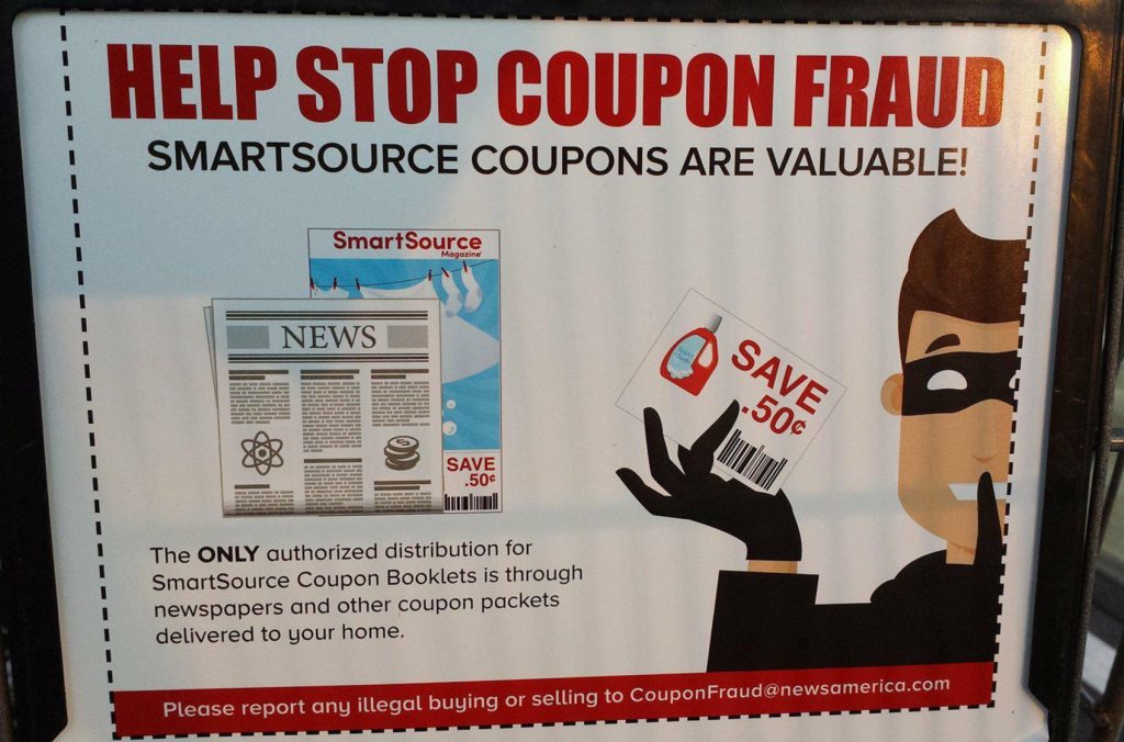 Coupon fraud sign in grocery store cart