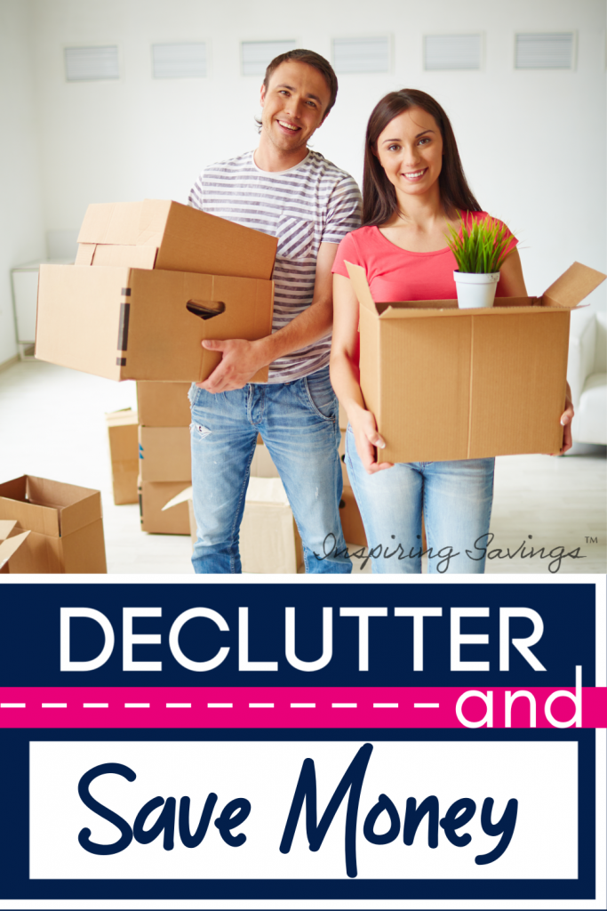 Couple Decluttering their home. Cardboard Boxes in hand