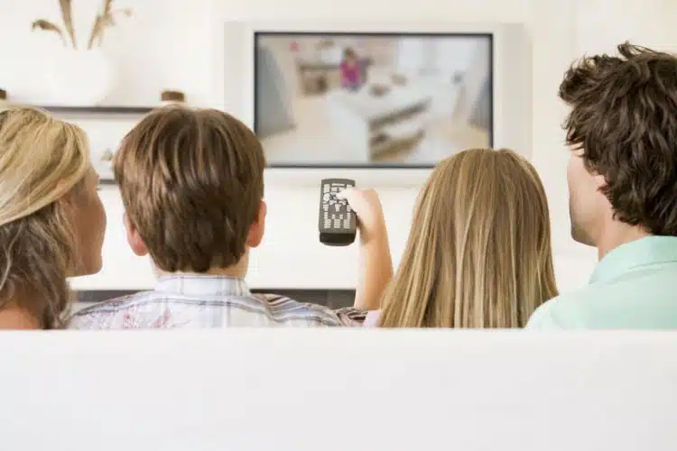 Family Watching tv lower your cable bill e1590682003527