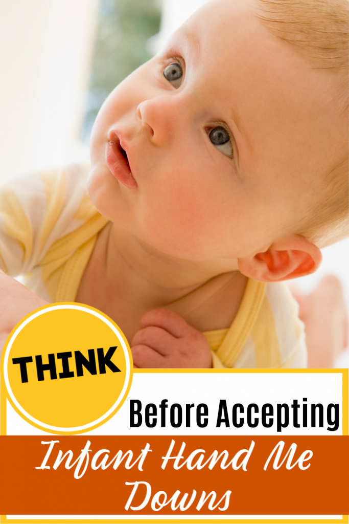 Think before accepting infant hand me-downs - Pictured baby on tummy smiling