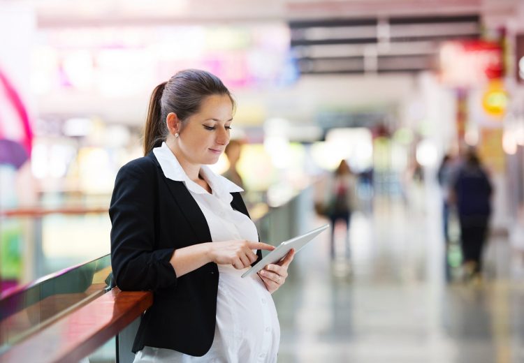 Woman Looking for digital coupons while shopping - Get Free Grocery Coupons