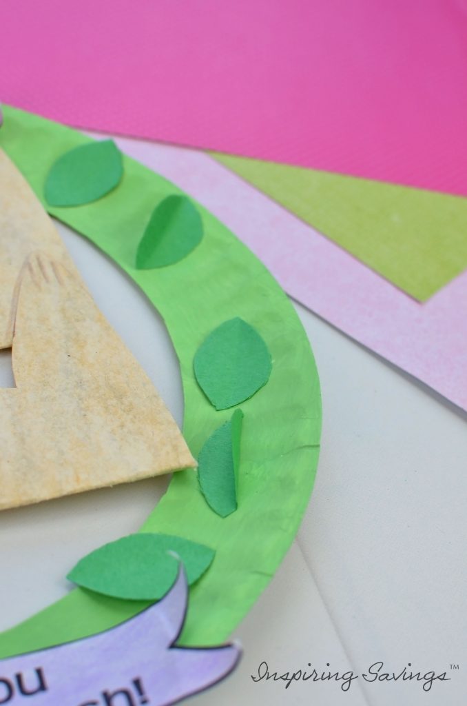 Adding leaves to mother's day card wreath