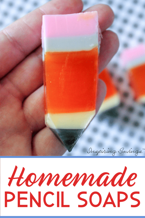 Holding homemade soap that looks like a pencil