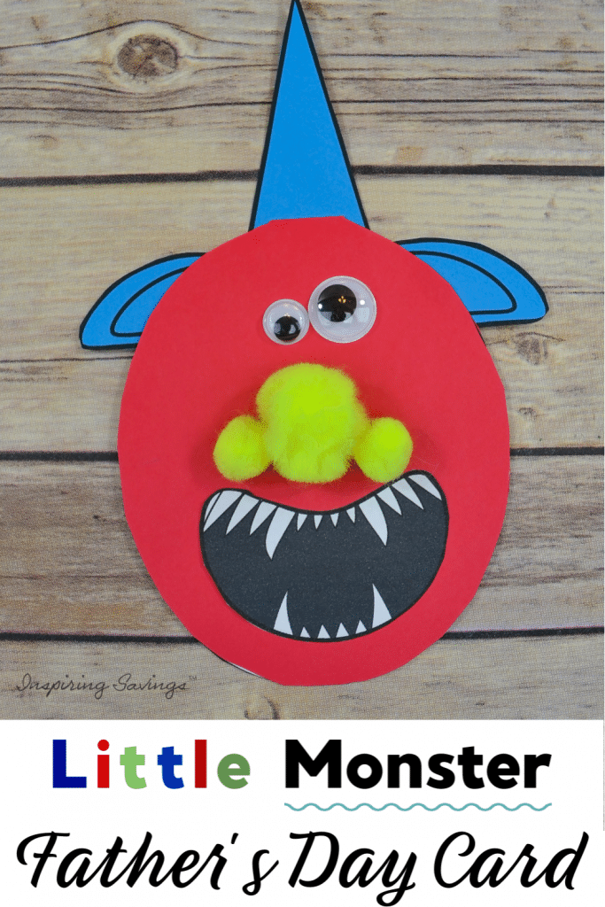 Little Monster Father's Day Card on brown wood background