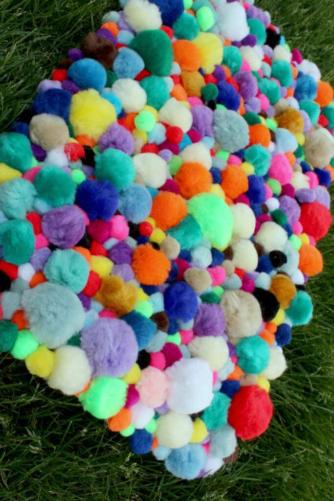 pom pom rug on grass