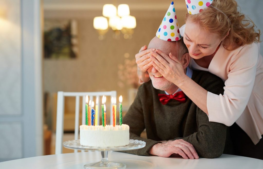 Couple celebrating birthday with a cake