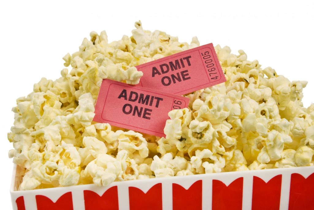 Popcorn for the movies with movie tickets