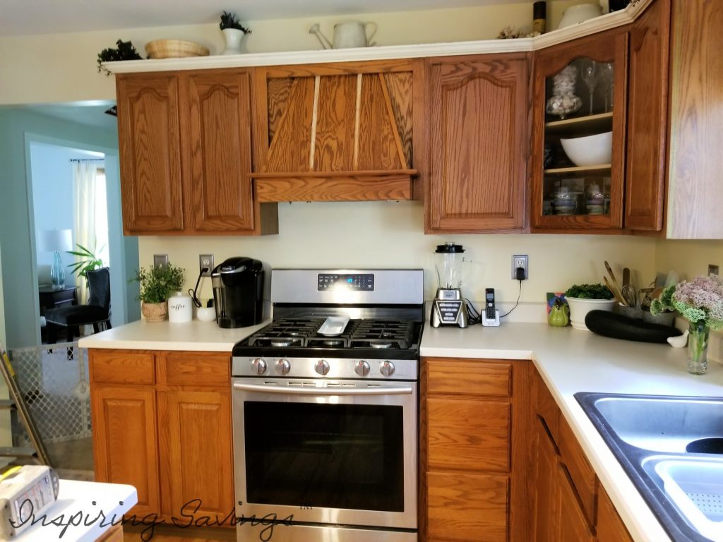 The Best Way to Paint Kitchen Cabinets - Kitchen before painting- pictured oak colored cabinets