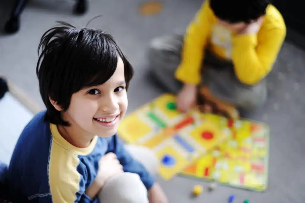 Kids playing board game