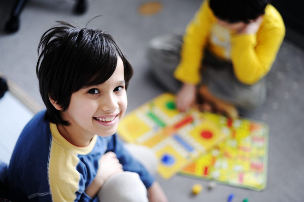 Kids Playing board game together