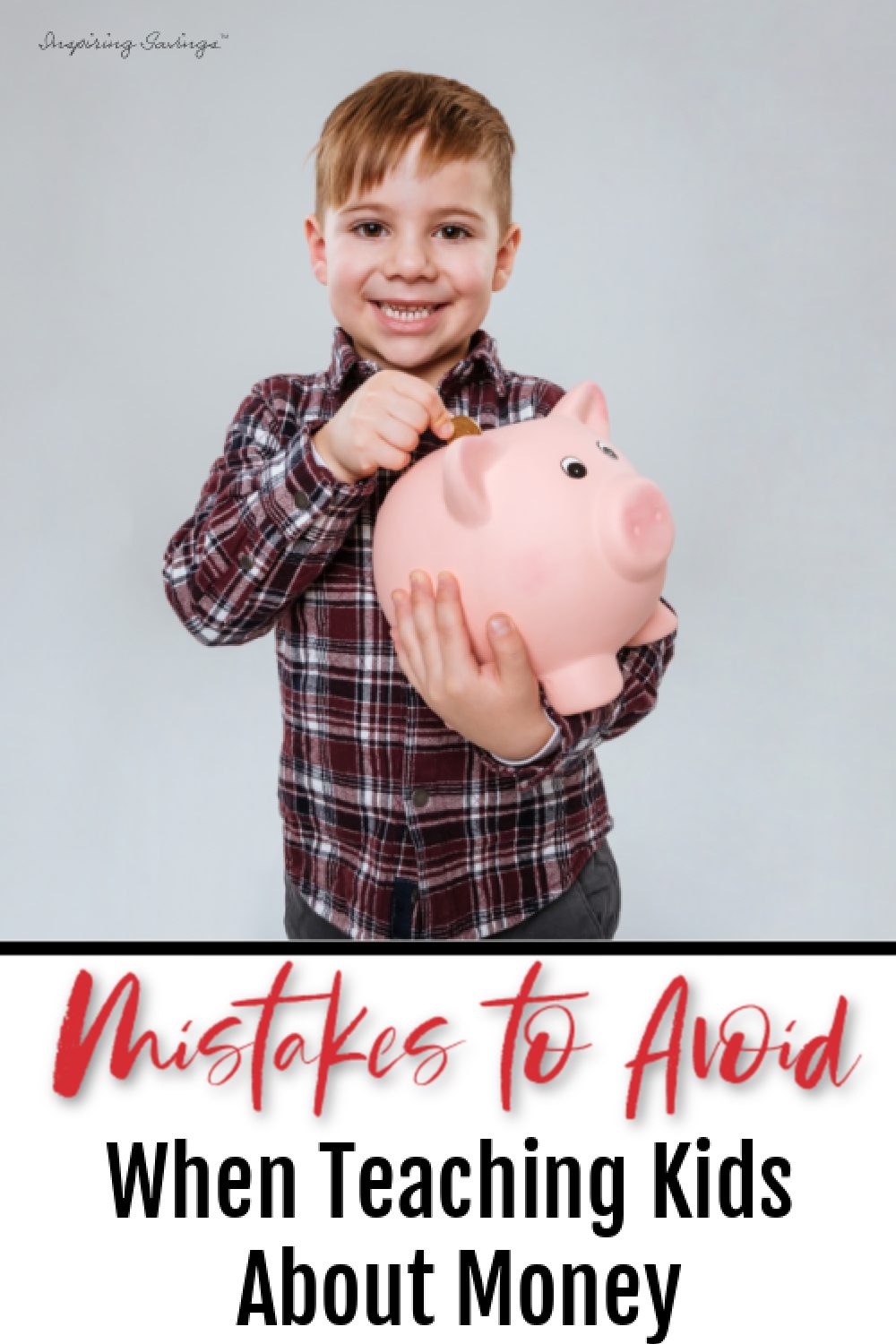 Boy holding piggy bank