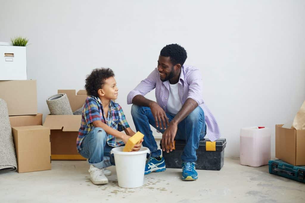 father son doing chores together