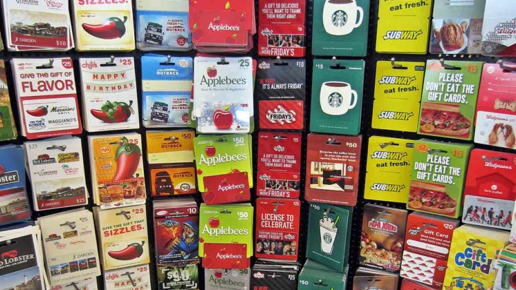 gift cards on display at a grocery store