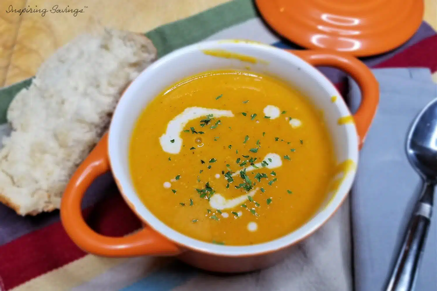 Roasted Butternut Squash Soup in orange crock ready to serve.