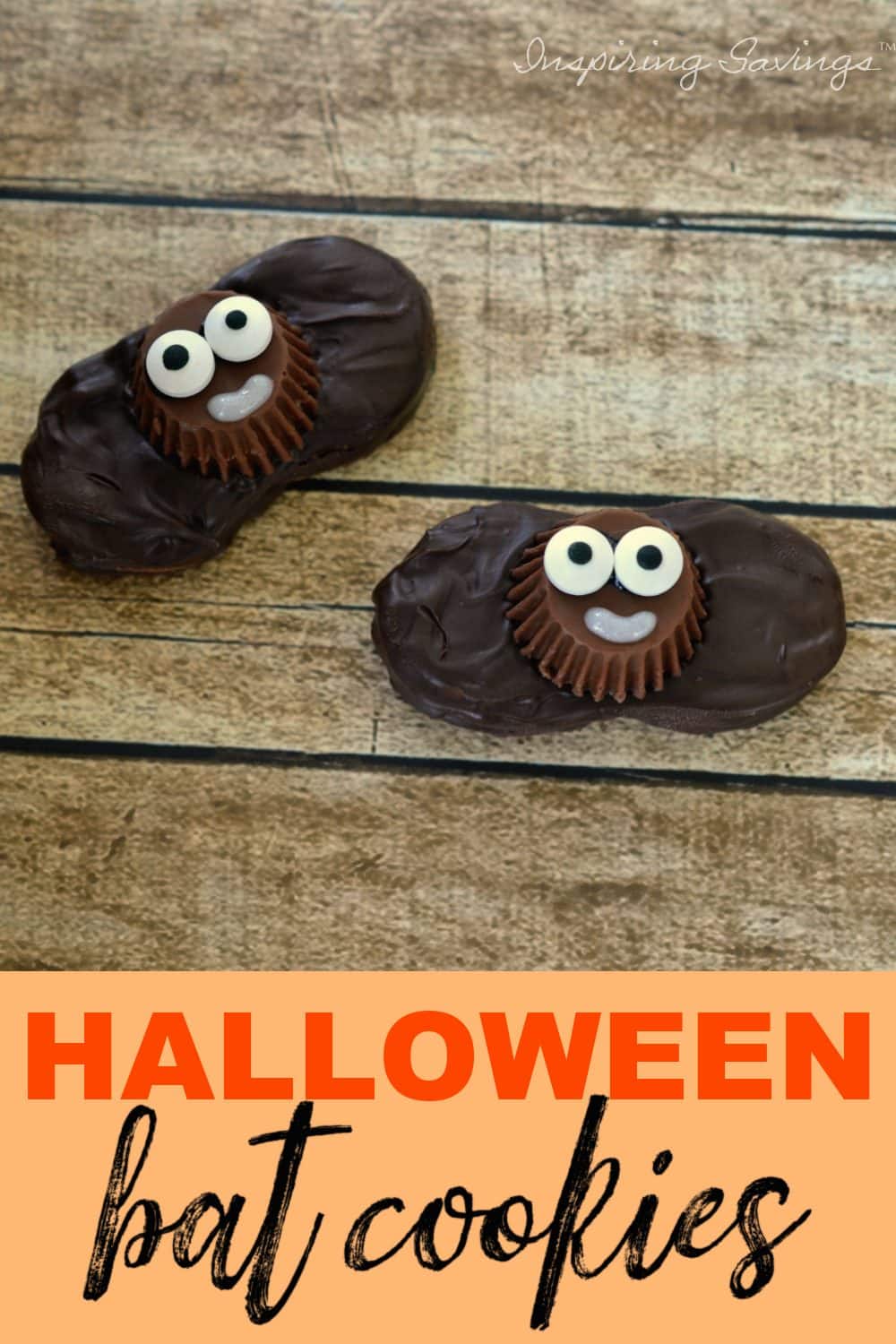Halloween bat cookies on brown wood background