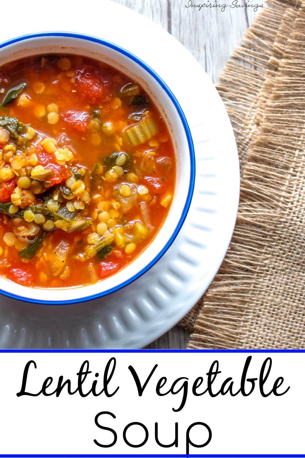 Lentil soup in blue rimmed bowl on white plate