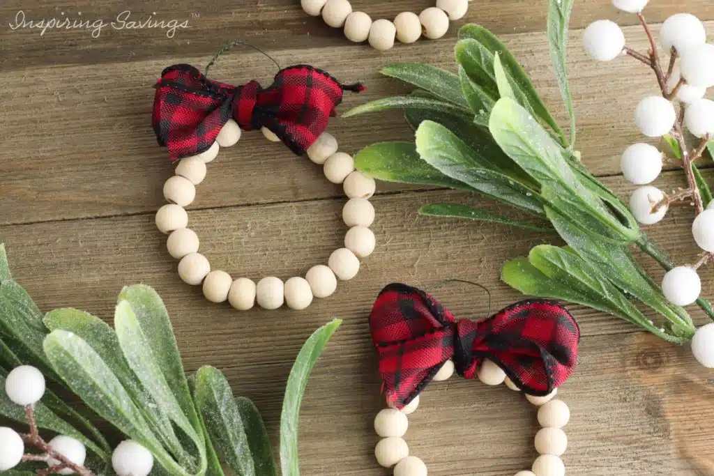 Finished DIY wood bead wreath Christmas ornaments - on wood background
