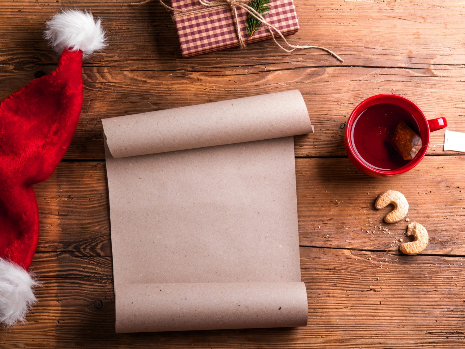 making a list for christmas on wooden background