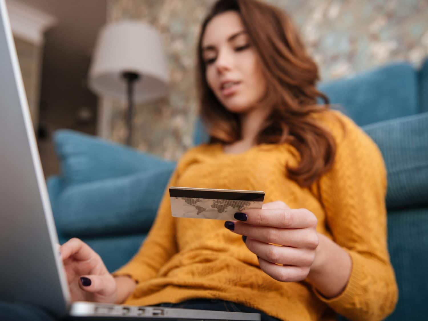 Woman Using Credit card to make online purchase