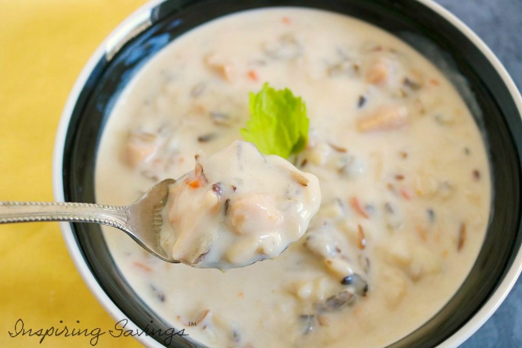 Delicious creamy chicken and rice soup in bowl.