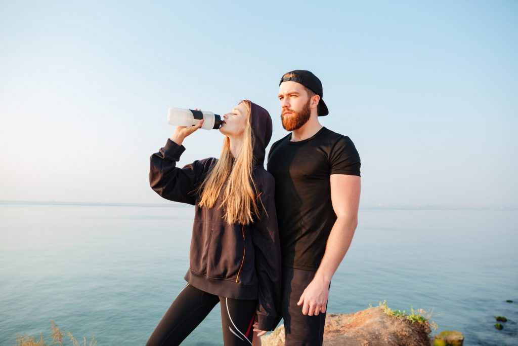 couple hiking - reusable water bottle - gifts that save money