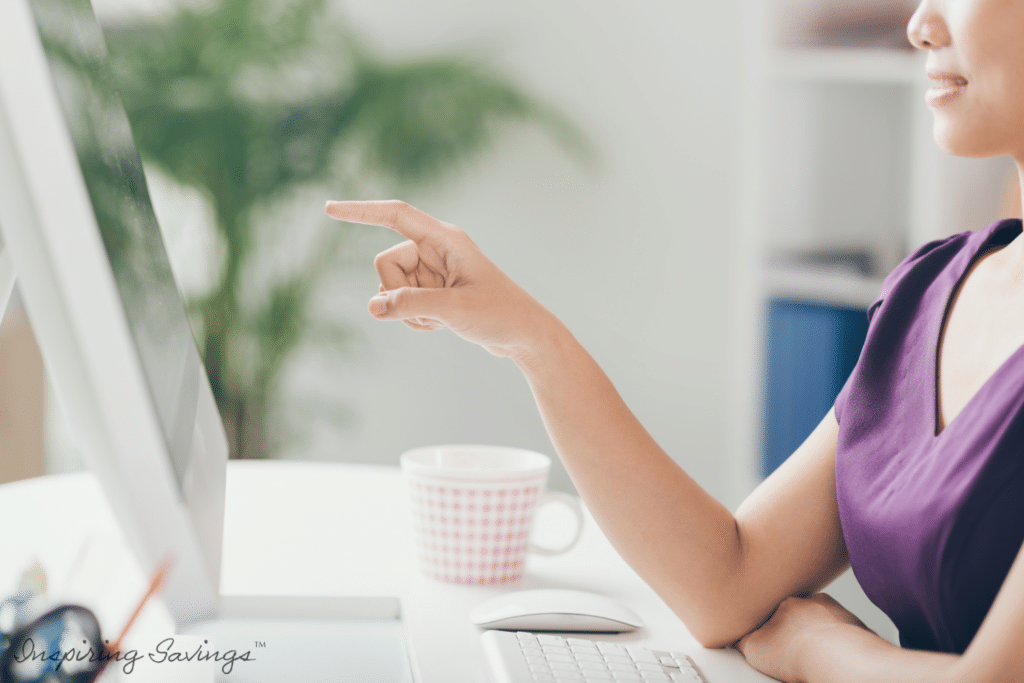 Woman searching the best printable coupon sites on home computer