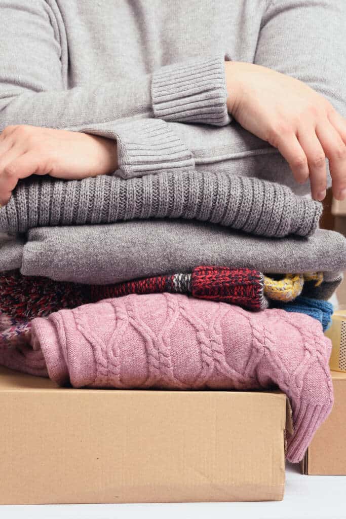 FreeCycle -pictured stack of sweaters and a box