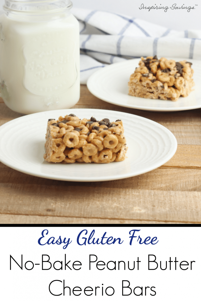 On white place gluten free peanut butter cheerio bar with mason jar glass of milk.