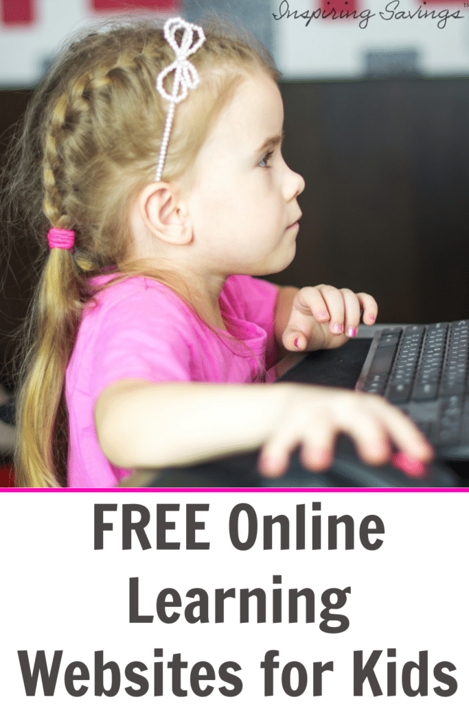 Little girl in pink sitting in front of computer playing a learning game