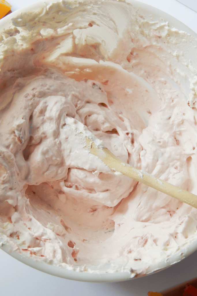 Mixing all ingredients together for strawberry fruit dip