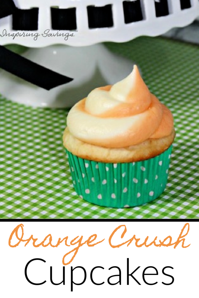 Orange Crush Cupcakes on green background next to cupcake stand