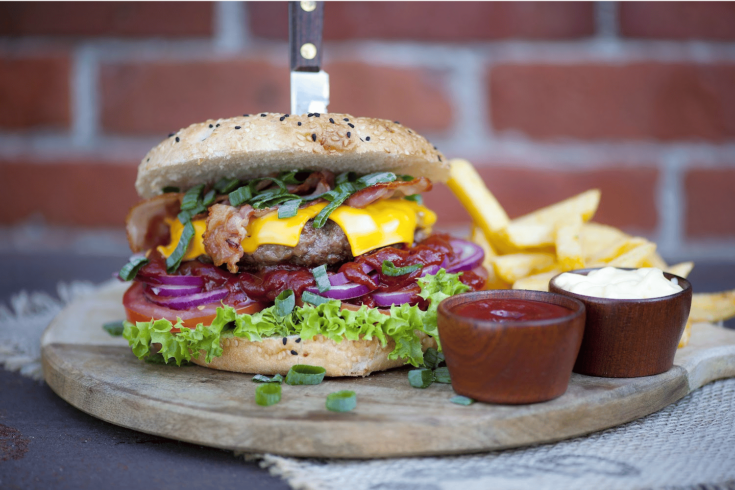 Cheeseburger on cutting board