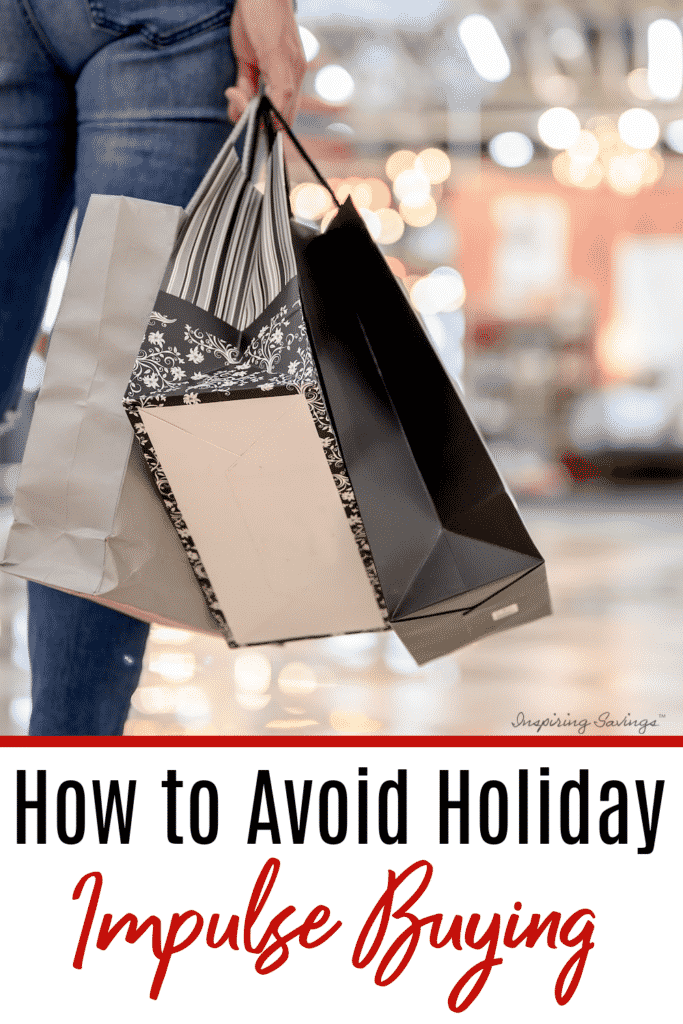 How to avoid Holiday Impulse Buying - woman holding shopping bags in hand at mall shopping for Christmas presents
