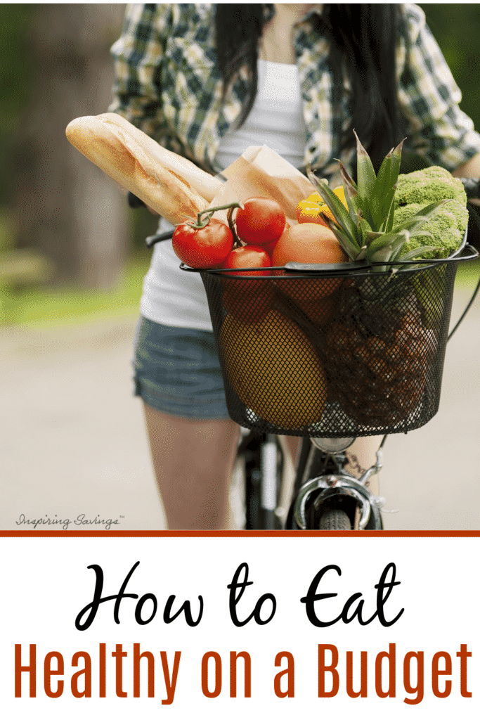 Woman riding bike with front basket filled with freshly picked produce