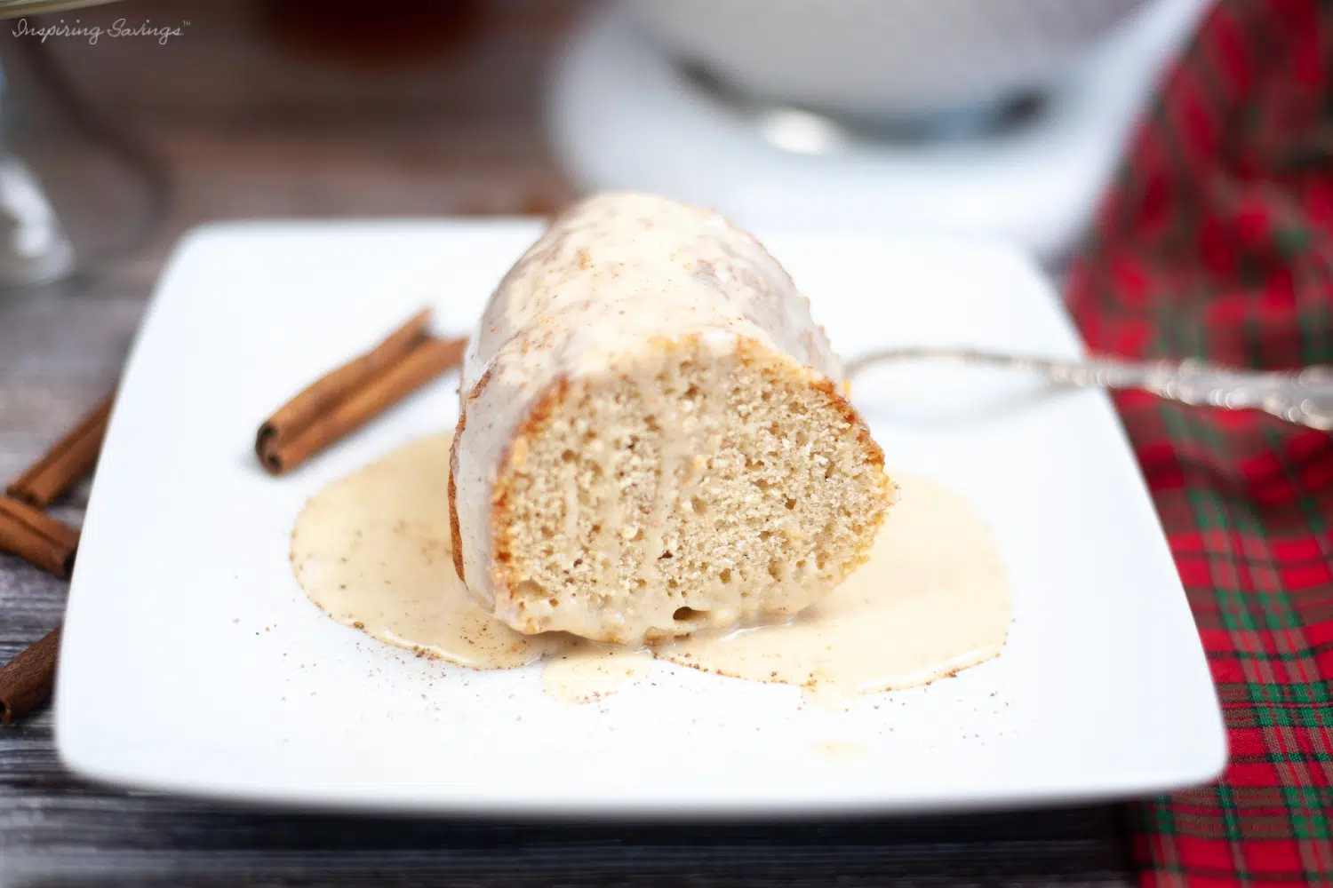 Eggnog Bundt cake with glaze on white plate