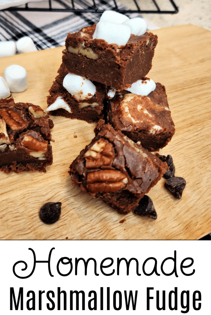 Homemade Marshmallow Fudge on cutting board in squares