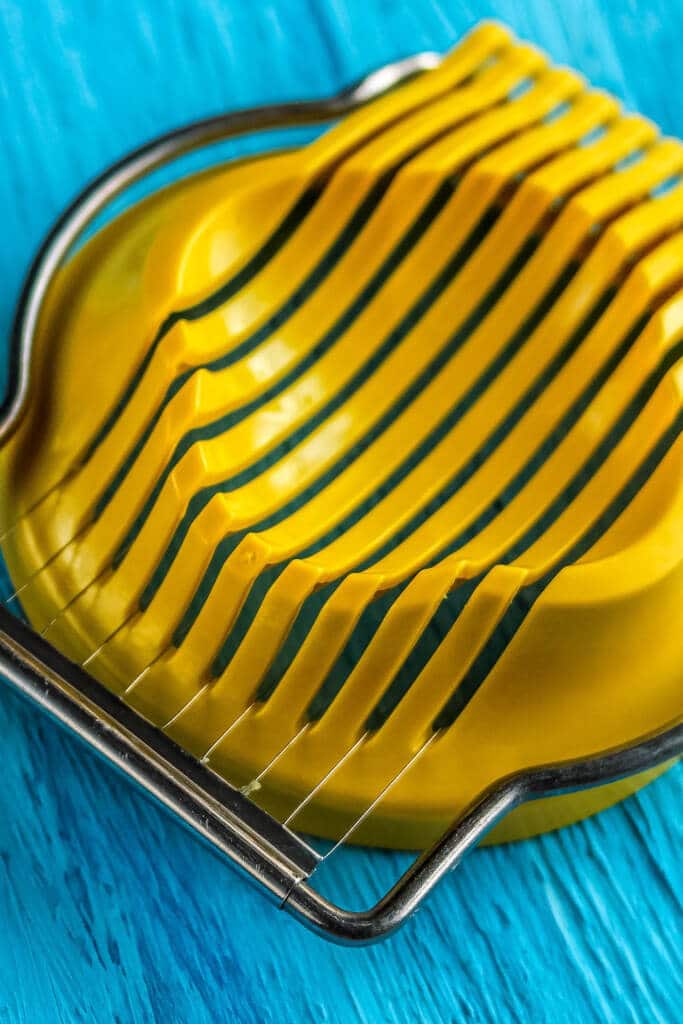 egg slicer on blue background