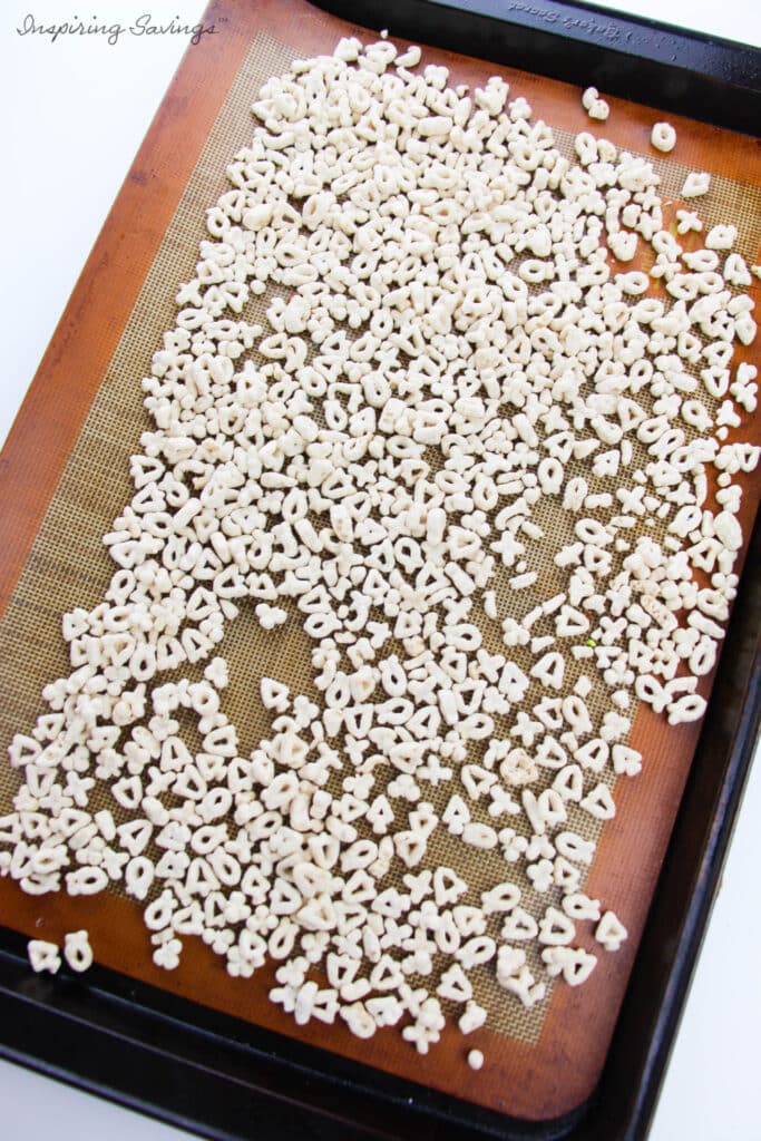 Toasting Lucky Charms Cereal on baking sheet with silicone mat