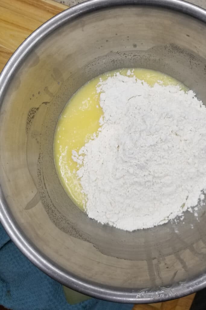 Adding flour to liquid mixture