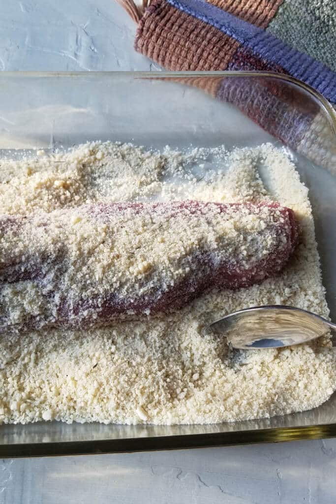Covering pork tenderloin in panko bread crumbs