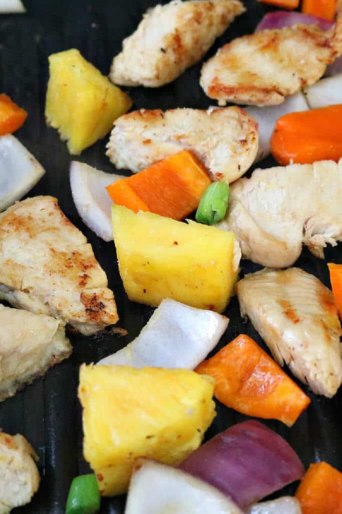 Grilling chicken and vegetables Jerk Chicken