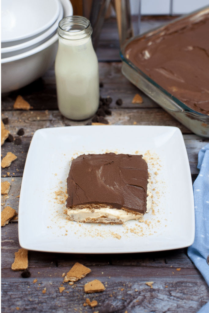 Homemade Chocolate eclair Icebox cake slice on white serving plate