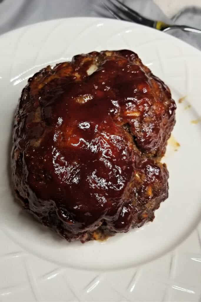 Meatloaf cooked on white plate