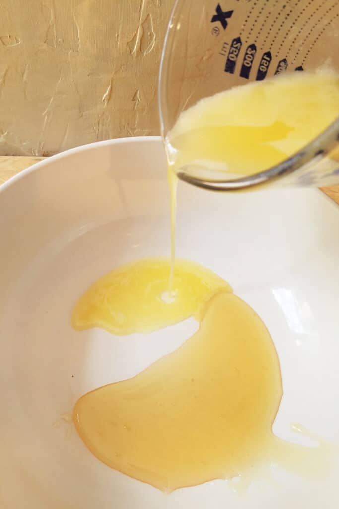 Mixing butter and honey together in bowl